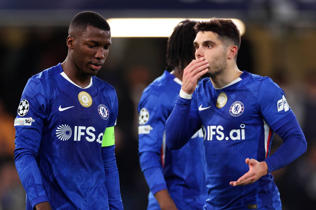 Pedro Neto of Chelsea reacts toward Moises Caicedo during the UEFA Champions League 2025/26 Round of 16 Second Leg match between Chelsea FC and Paris Saint-Germain FC at Stamford Bridge
