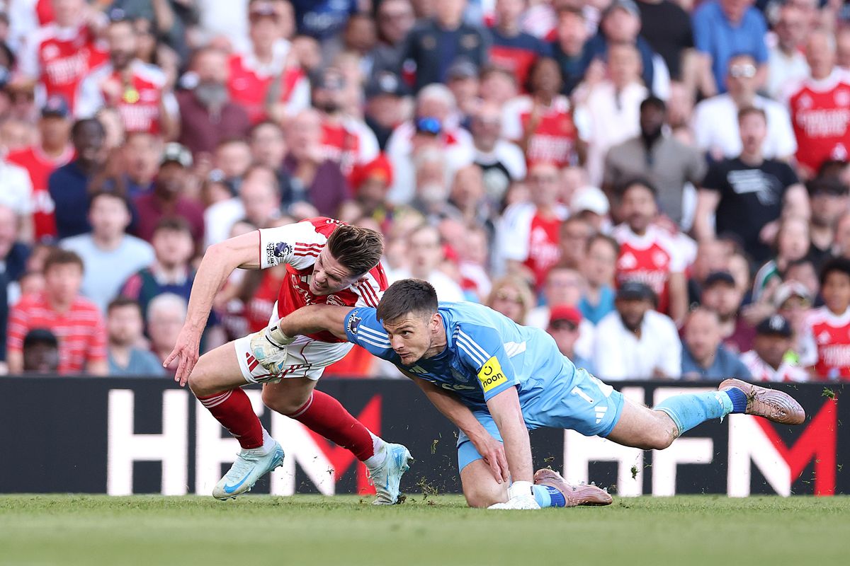 Newcastle goalkeeper Nick Pope fouls Arsenal's Viktor Gyokeres