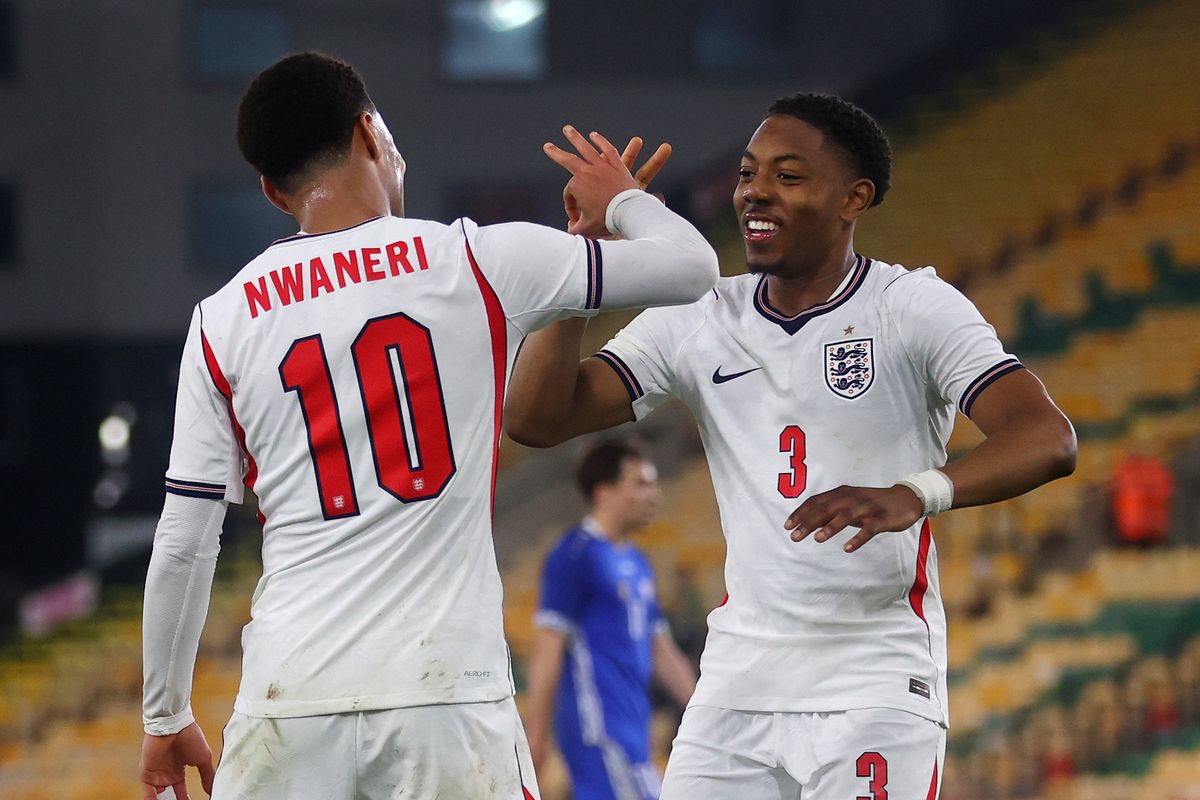 Ethan Nwaneri of England celebrates with Myles Lewis-Skelly after scoring a goal for England under-21s