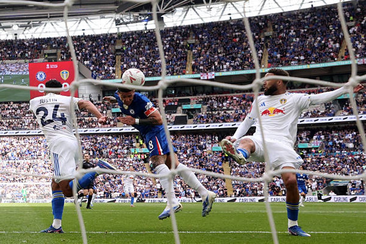 Chelsea's Argentinian midfielder #08 Enzo Fernandez (C) heads in the opening goal during the English FA Cup semi final football match between Chelsea and Leeds United at Wembley stadium in London, on April 26, 2026.