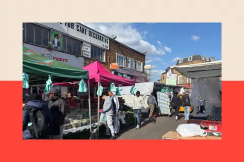Ridley Road market in Hackney with people shopping
