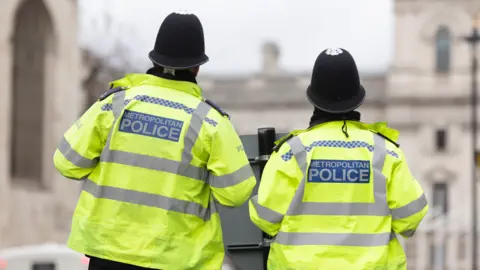 Getty Images Two police officers pictured in Westminster