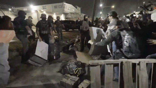 Agitators throwing mattresses and objects at ICE agents outside detention center